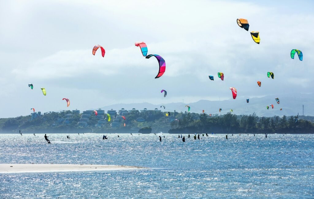 Kitesurfers enjoying wind power on Bulabog beach.